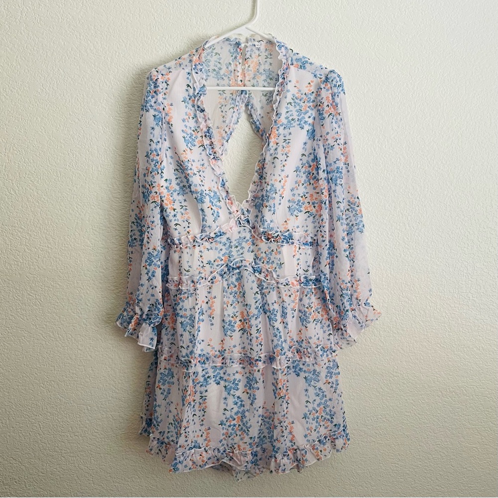 Floral V-Neck Backless Mini Dress. White With Blue and Orange Floral Print.